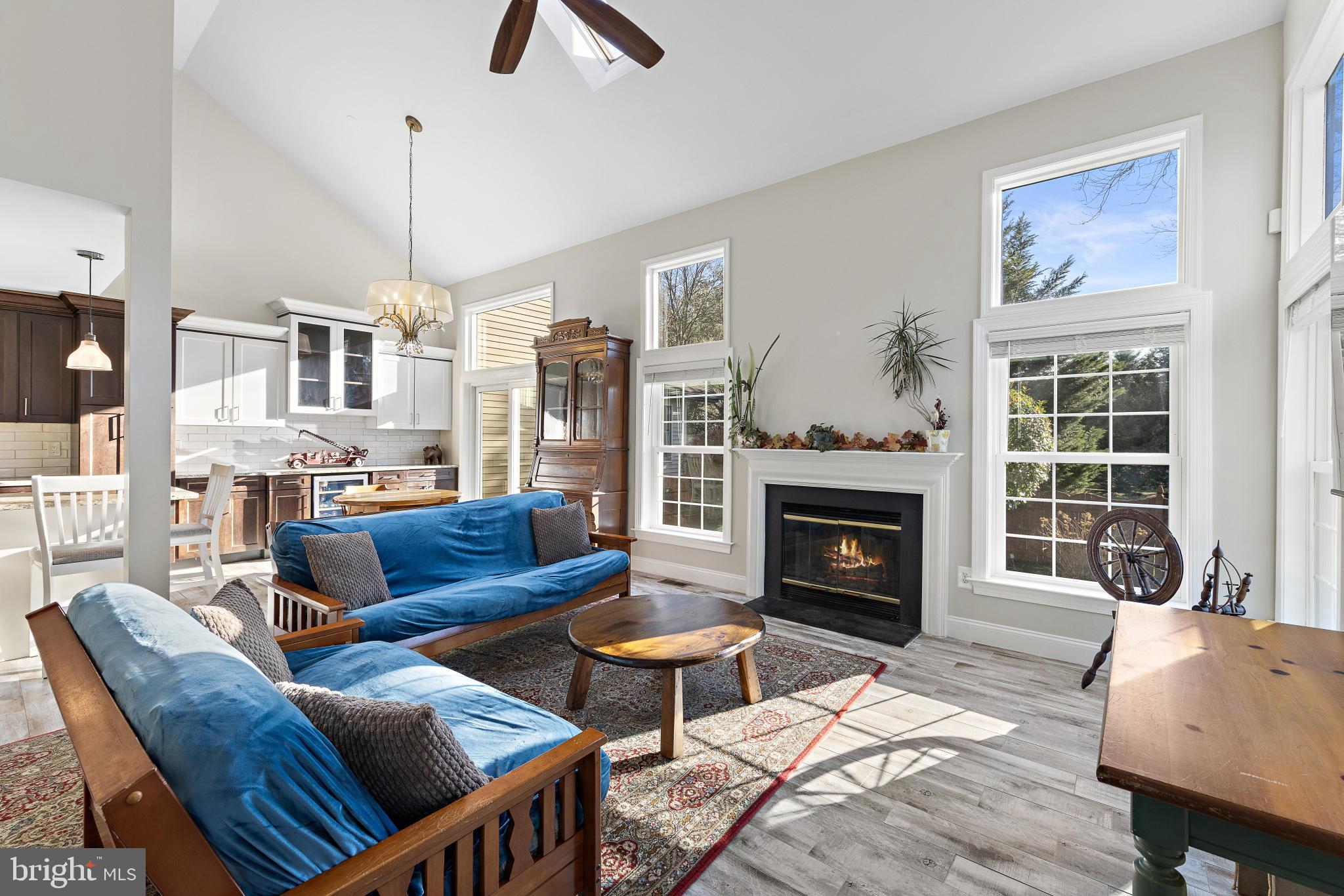 1 Hilltop Lane Medford, NJ 08055 - Photo 6 of 50 a living room with furniture a fireplace and a chandelier
