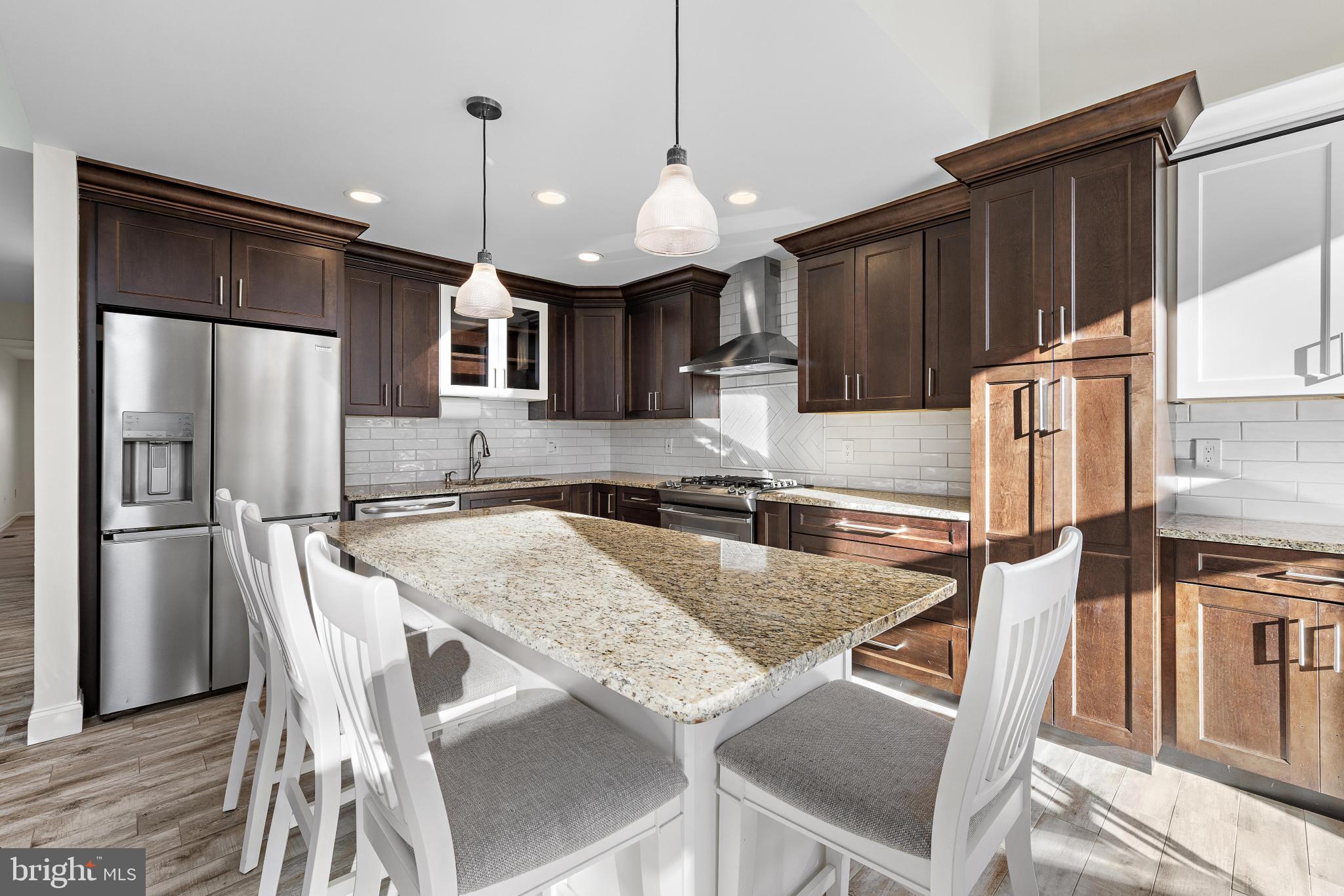 1 Hilltop Lane Medford, NJ 08055 - Photo 7 of 50 a kitchen with stainless steel appliances granite countertop a sink a stove and a refrigerator