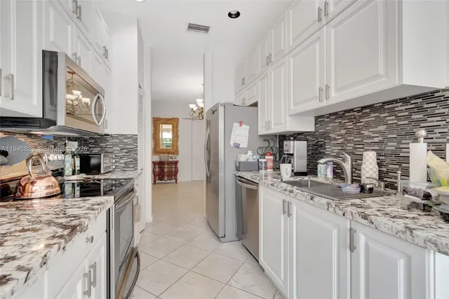 $440,000 | 6560 Villa Sonrisa Drive, Unit 1311, Boca Raton, FL 33433