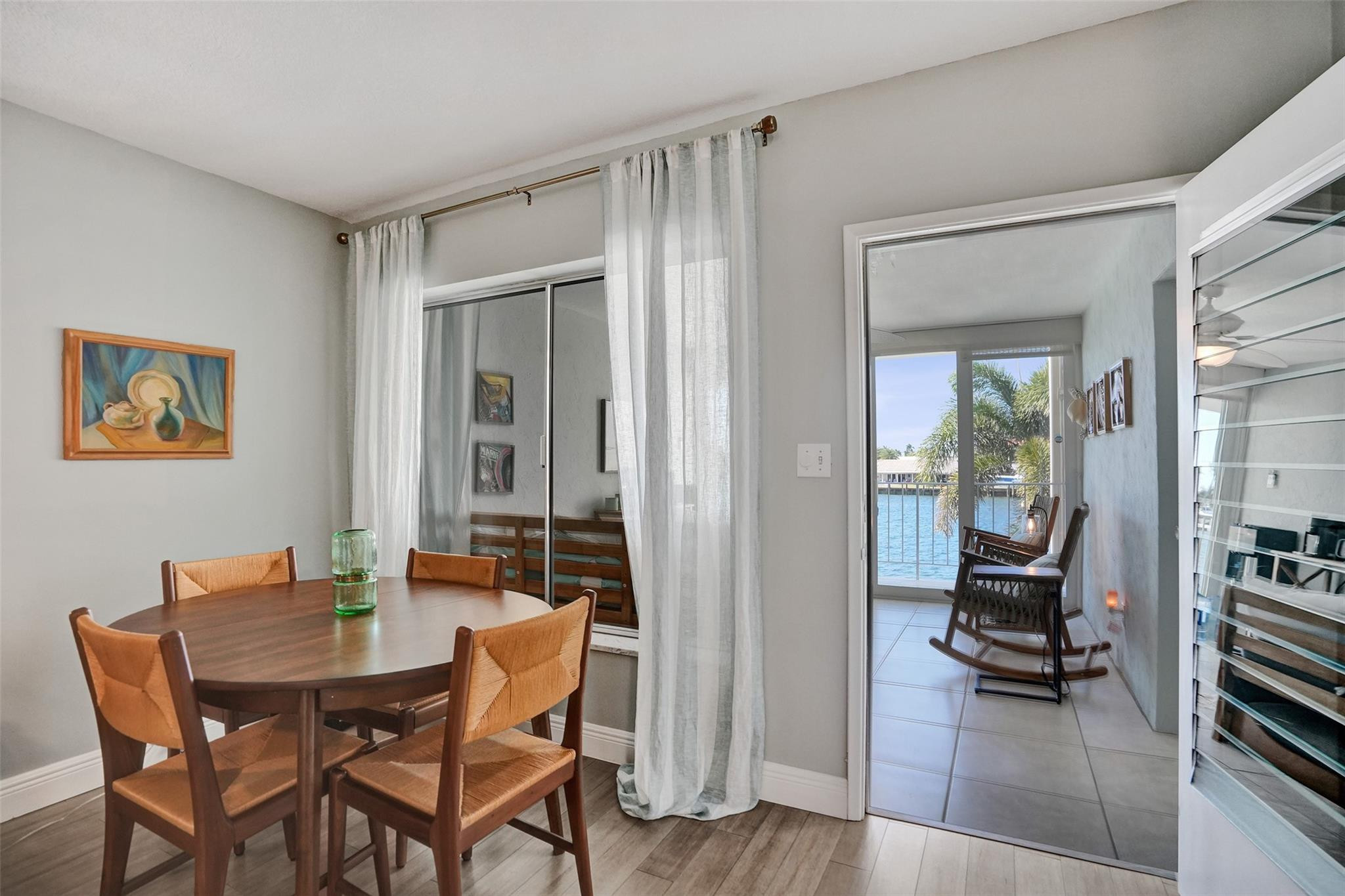 801 North Riverside Drive, Unit 4B Pompano Beach, FL 33062 - Photo 11 of 43 a dining room with furniture and wooden floor