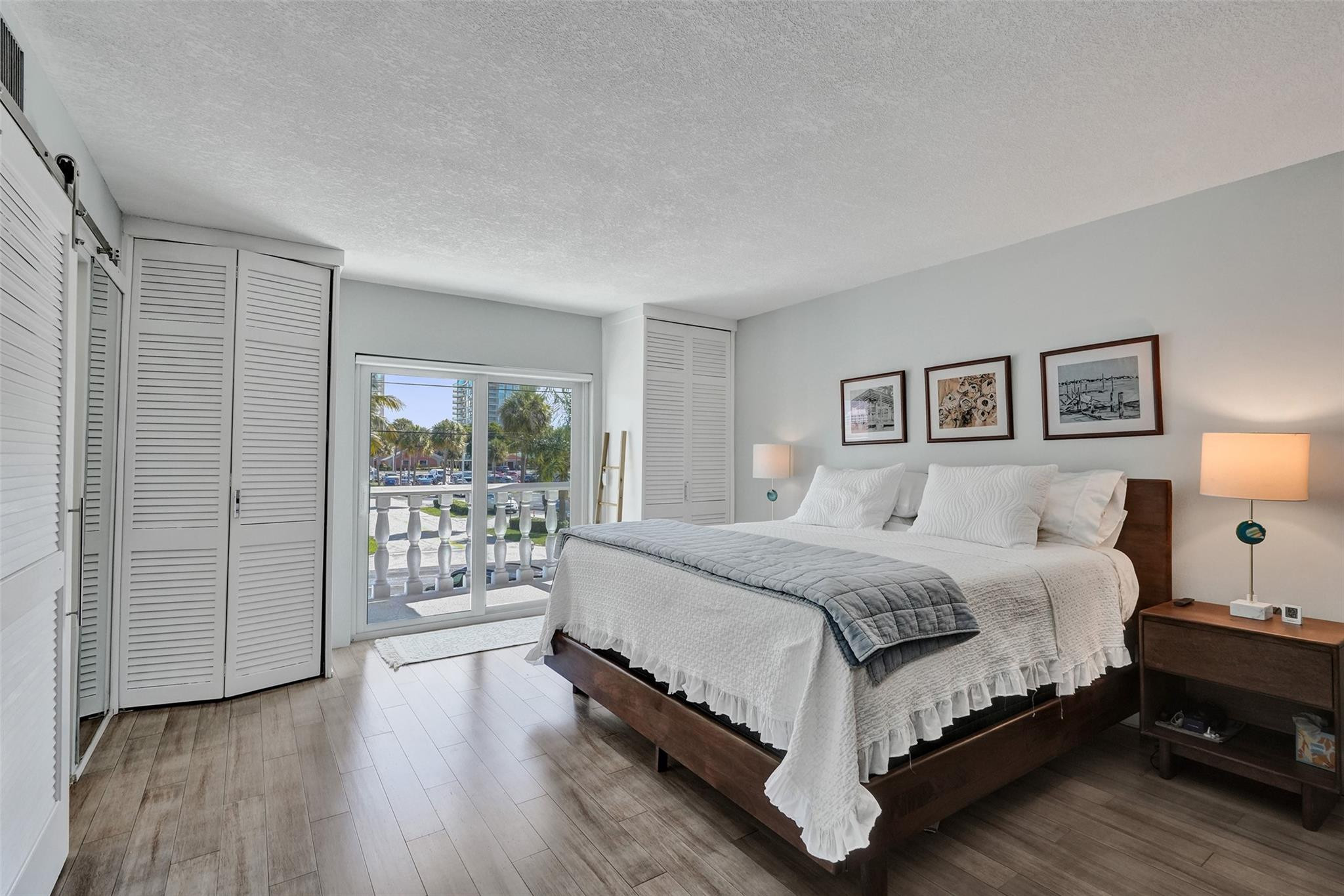 801 North Riverside Drive, Unit 4B Pompano Beach, FL 33062 - Photo 16 of 43 a bedroom with a bed and a view of bedroom