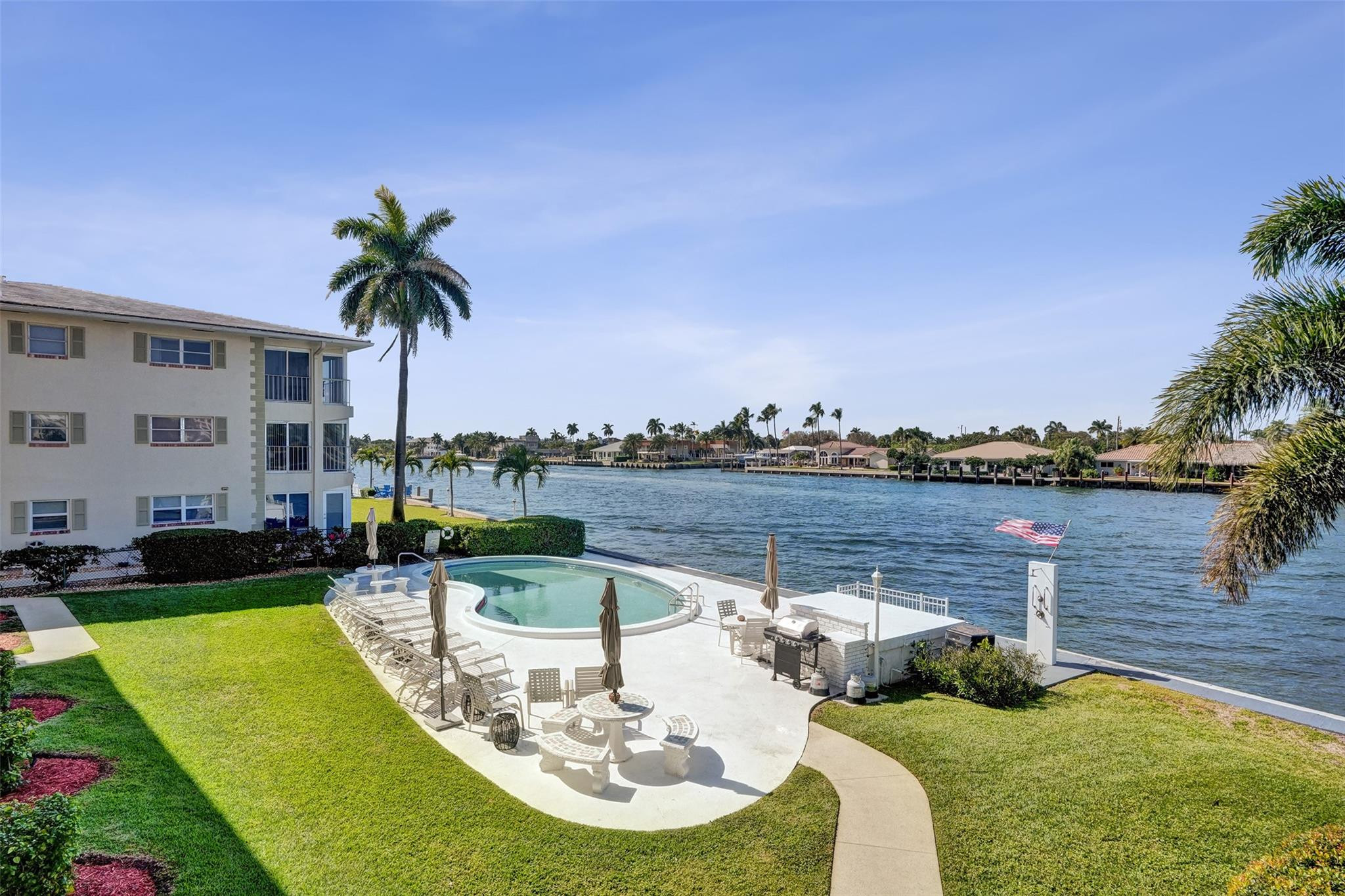 801 North Riverside Drive, Unit 4B Pompano Beach, FL 33062 - Photo 21 of 43 a view of a swimming pool with a patio