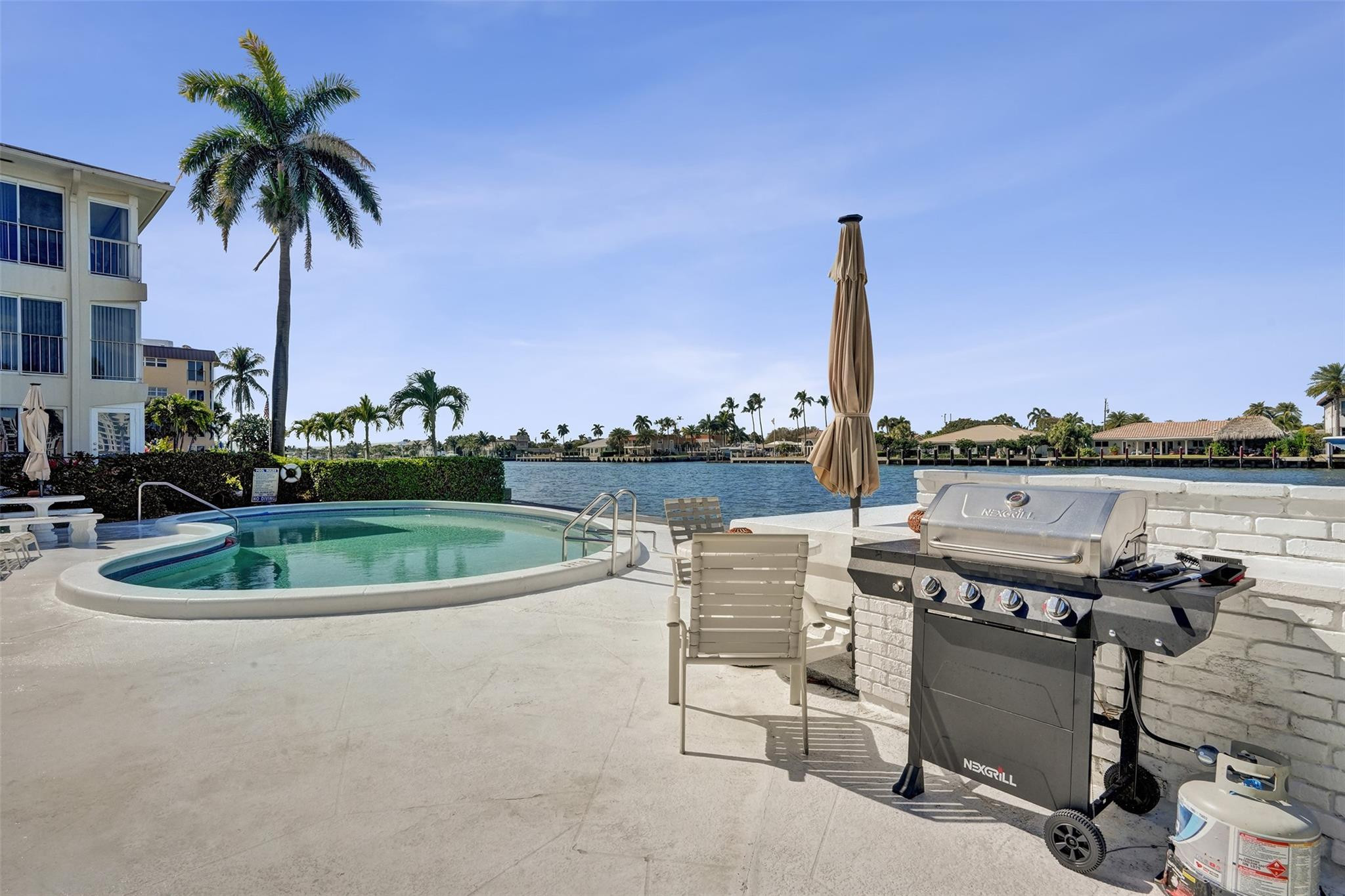 801 North Riverside Drive, Unit 4B Pompano Beach, FL 33062 - Photo 27 of 43 a view of a swimming pool and a terrace