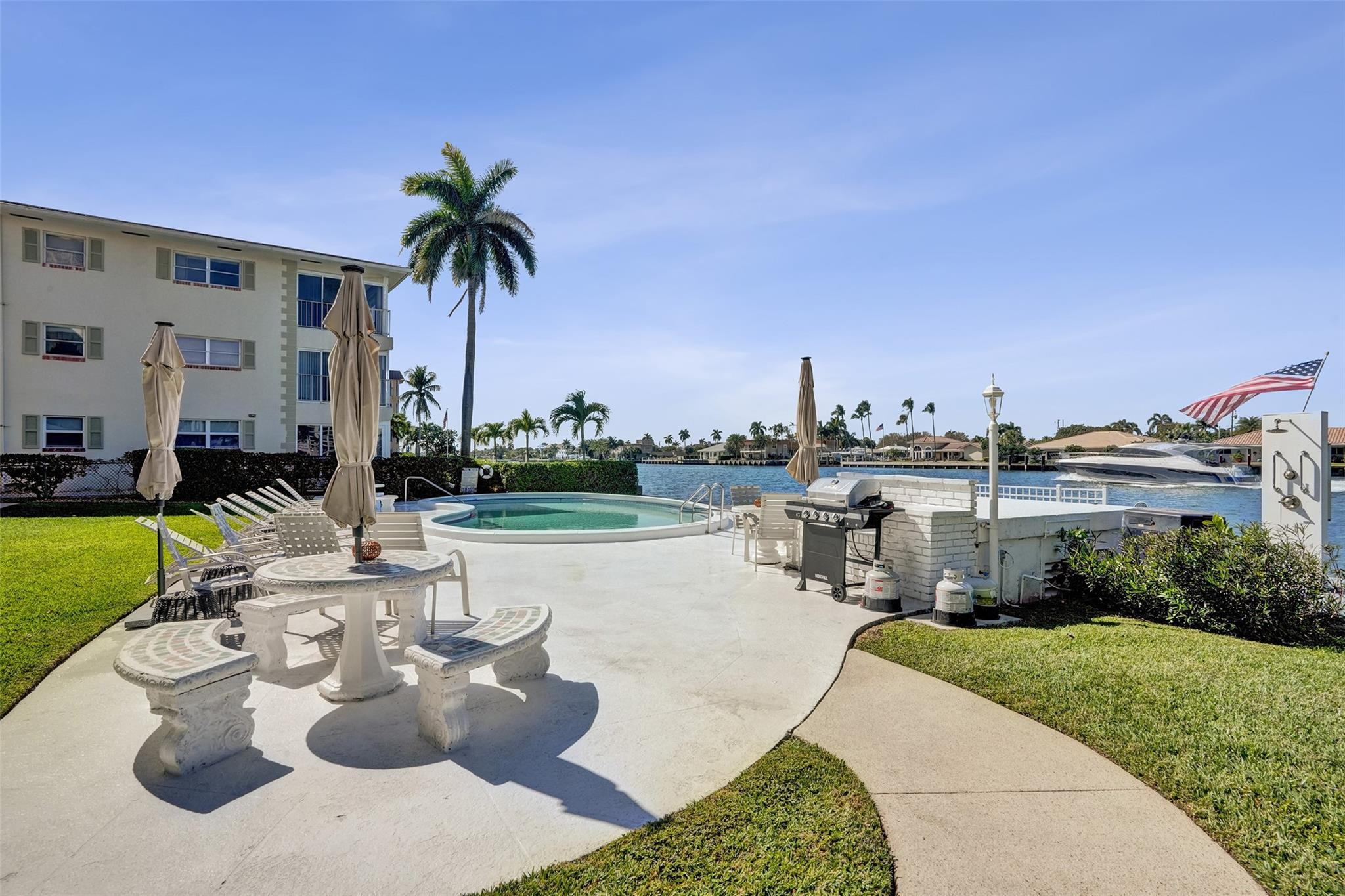 801 North Riverside Drive, Unit 4B Pompano Beach, FL 33062 - Photo 28 of 43 a view of a patio with couches and potted plants