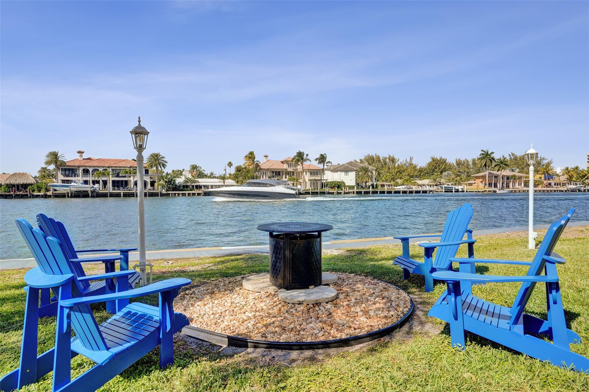 801 North Riverside Drive, Unit 4B Pompano Beach, FL 33062 - Photo 29 of 43 a view of a lake with a table and chairs