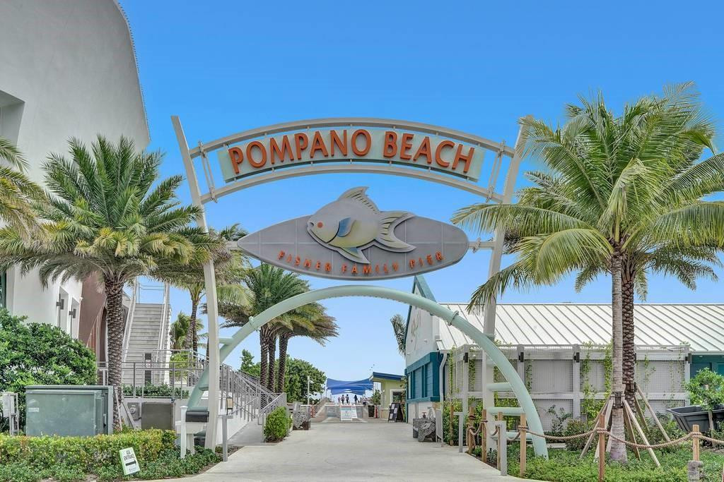 801 North Riverside Drive, Unit 4B Pompano Beach, FL 33062 - Photo 37 of 43 a sign that is on the side of a road