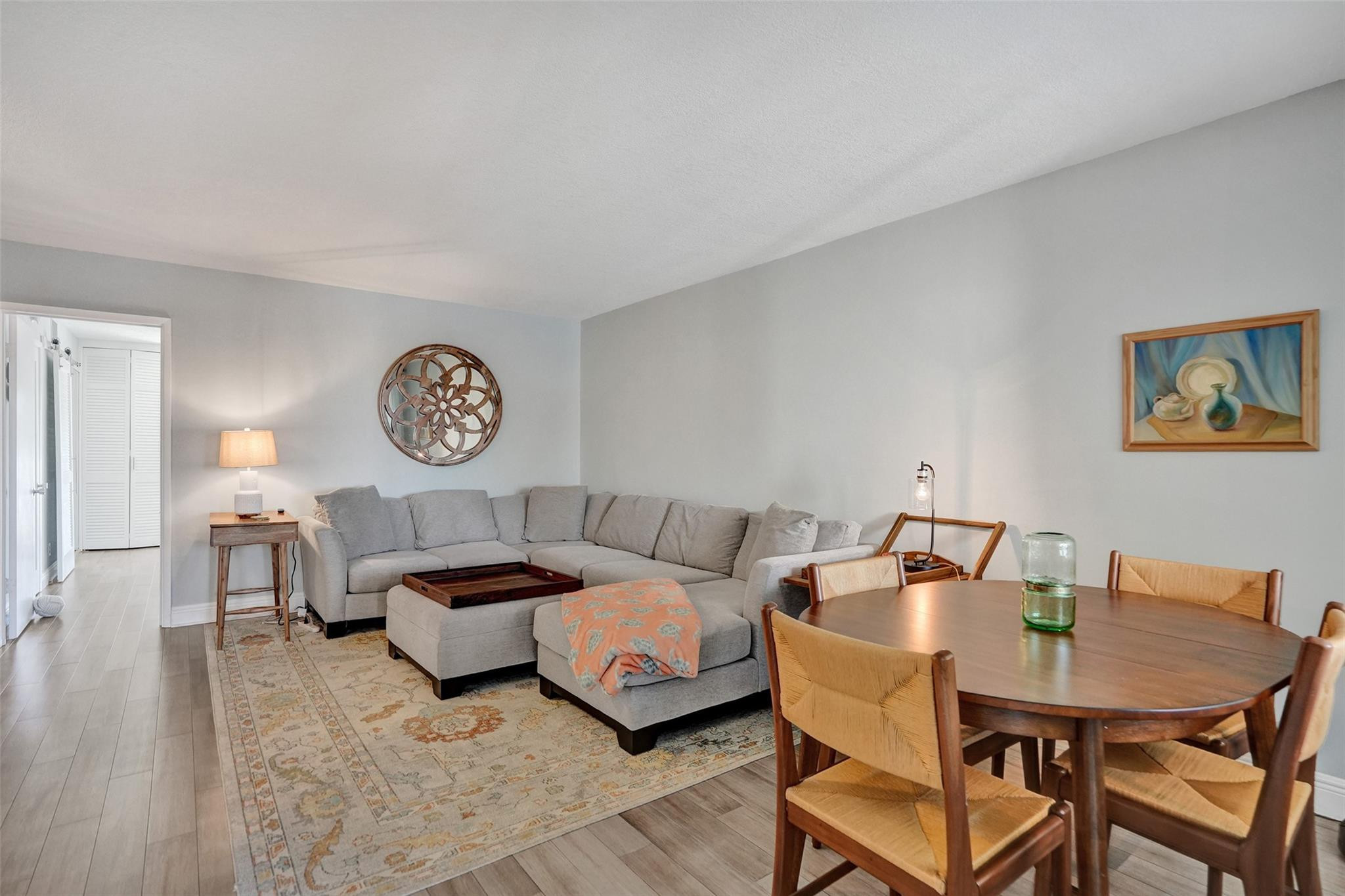 801 North Riverside Drive, Unit 4B Pompano Beach, FL 33062 - Photo 10 of 43 a living room with furniture and a table