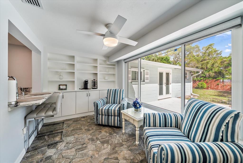 2431 Bispham Road Sarasota, FL 34231 - Photo 12 of 25 a living room with furniture and a large window