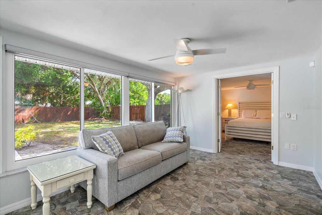 2431 Bispham Road Sarasota, FL 34231 - Photo 13 of 25 a living room with furniture and a large window