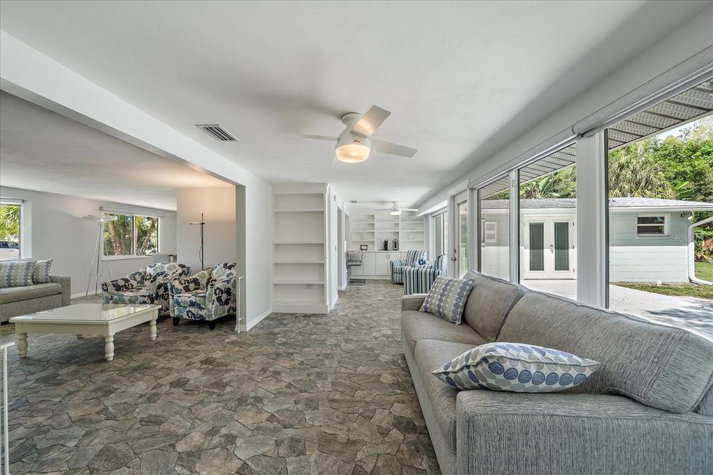 2431 Bispham Road Sarasota, FL 34231 - Photo 14 of 25 a living room with furniture and a large window