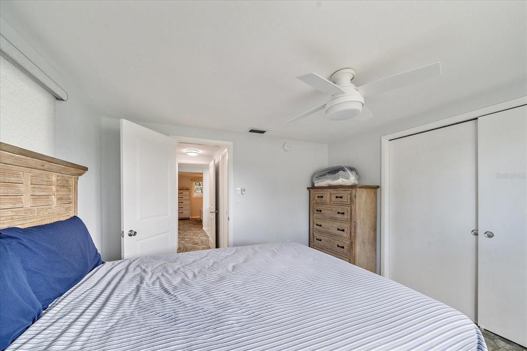 2431 Bispham Road Sarasota, FL 34231 - Photo 19 of 25 a bedroom with a bed and a dresser