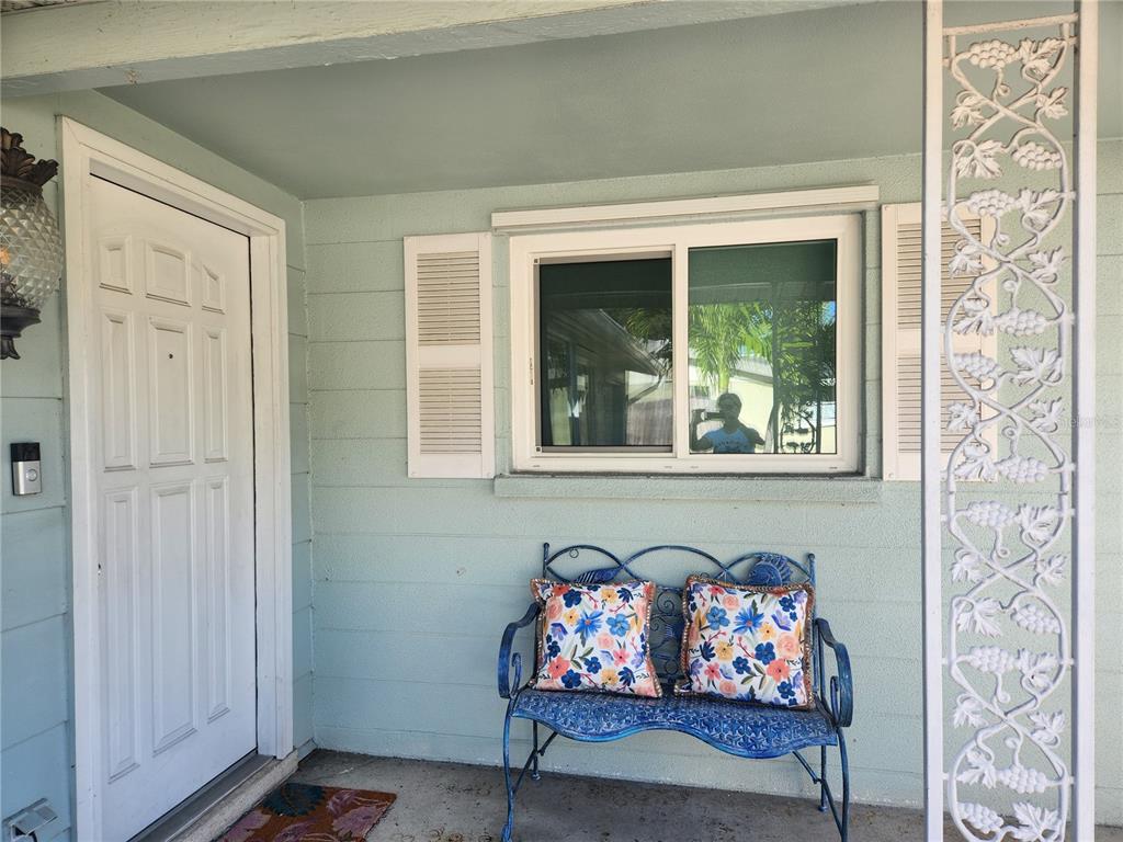 2431 Bispham Road Sarasota, FL 34231 - Photo 3 of 25 a living room with furniture and a fireplace