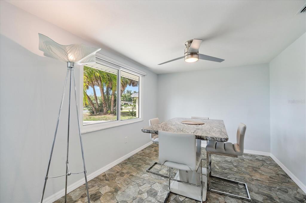 2431 Bispham Road Sarasota, FL 34231 - Photo 7 of 25 a workspace with furniture and window