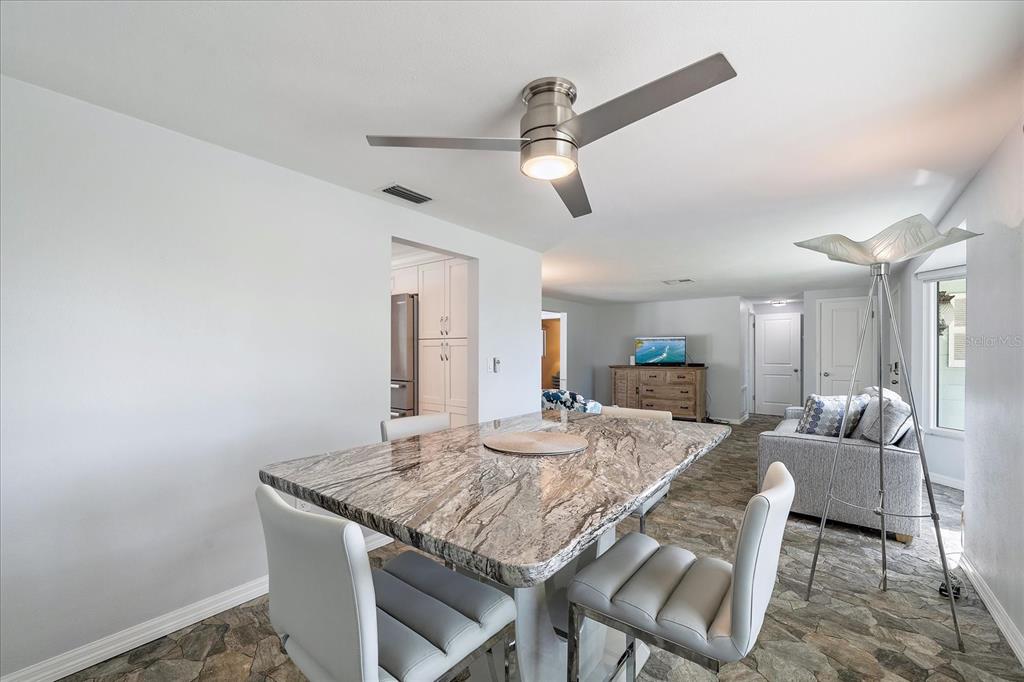 2431 Bispham Road Sarasota, FL 34231 - Photo 8 of 25 a view of a dining room with furniture