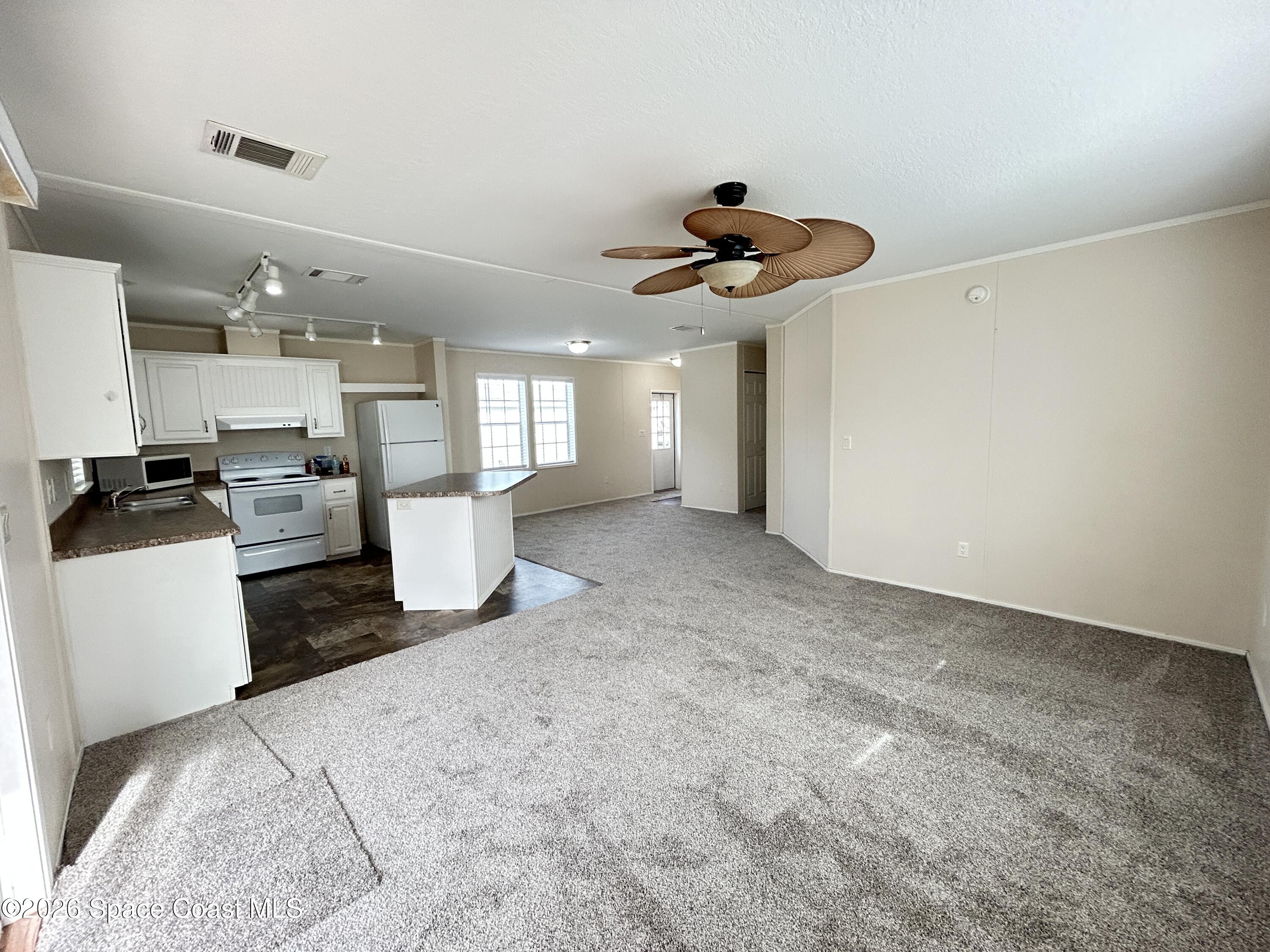 117 Lewis Street Edgewater, FL 32141 - Photo 11 of 26 LivRmKitDiningRm