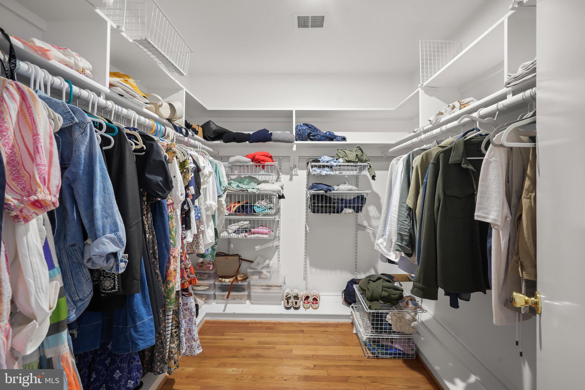 9809 Hall Road Potomac, MD 20854 - Photo 31 of 60 a view of walk in closet with clothes and shoes