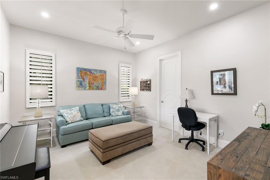 5903 Burnham Road Naples, FL 34119 - Photo 19 of 38 a living room with furniture and a window