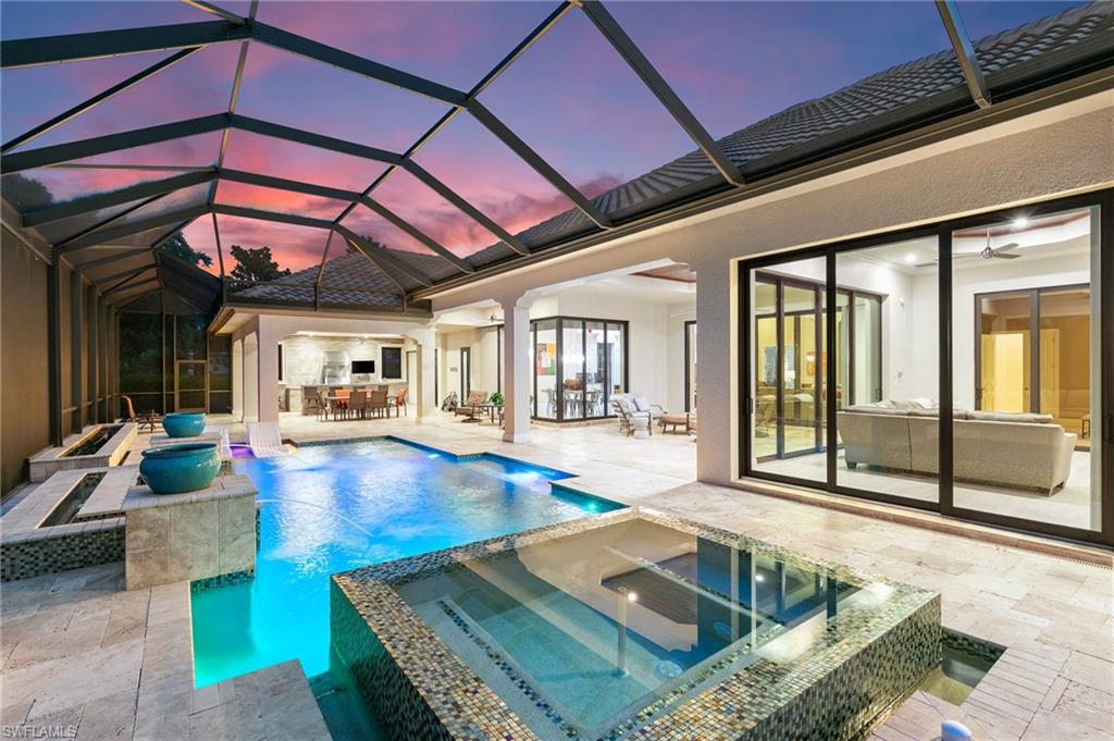 5903 Burnham Road Naples, FL 34119 - Photo 3 of 38 a dinning area with pool table and chairs