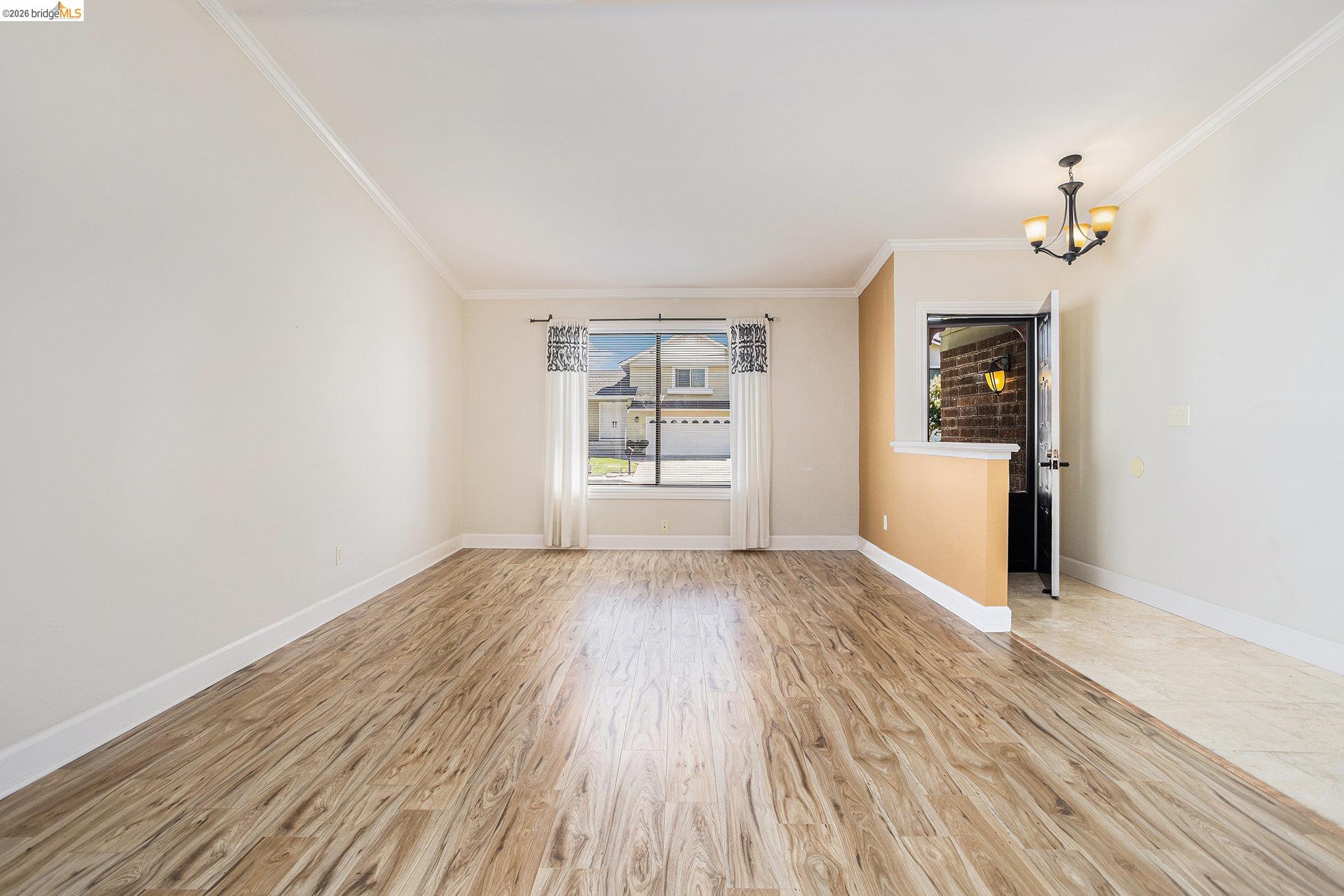3000 Sombrero Circle San Ramon, CA 94583 - Photo 3 of 19 wooden floor in an empty room with a window