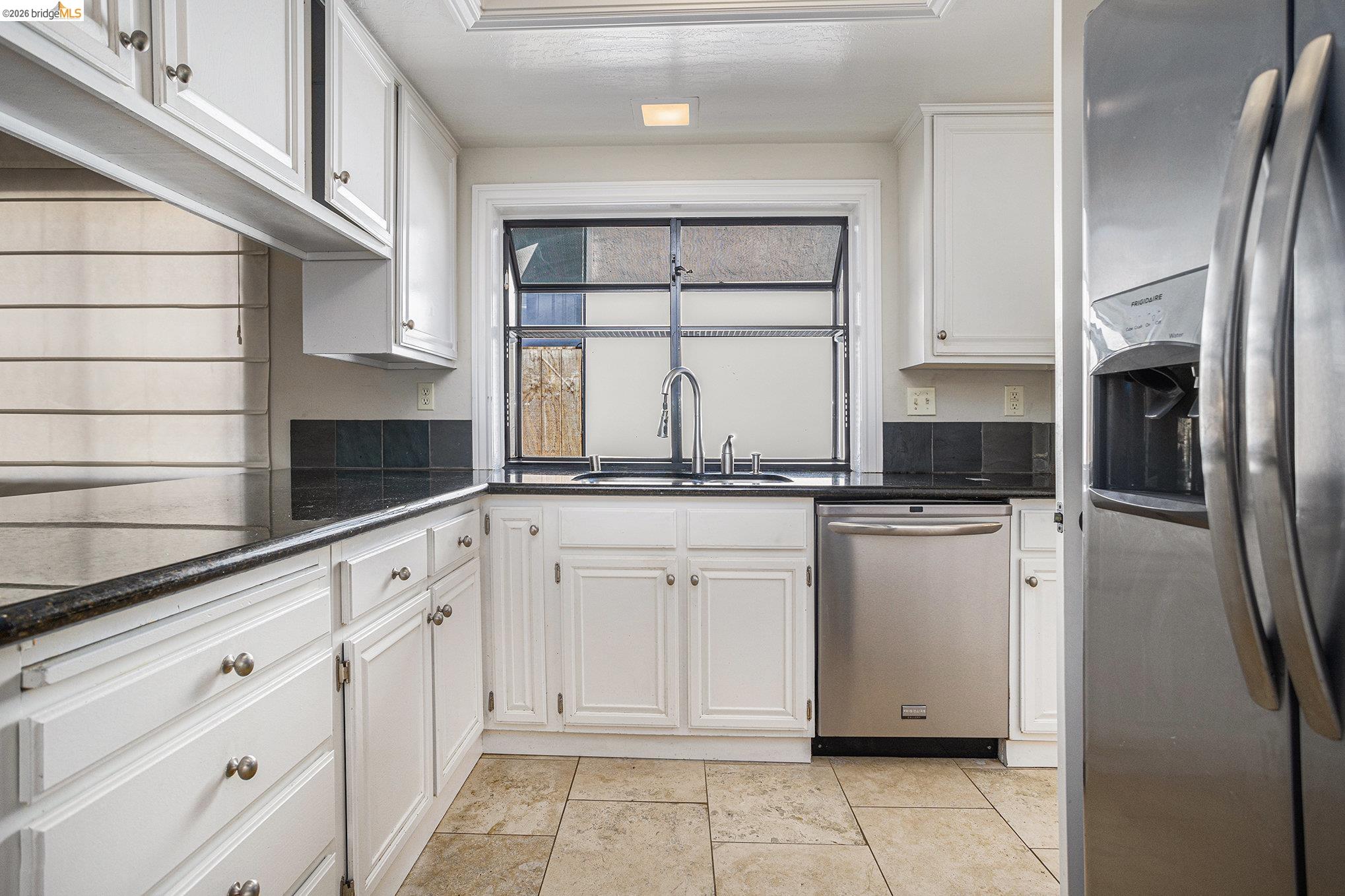 3000 Sombrero Circle San Ramon, CA 94583 - Photo 7 of 19 a kitchen with white cabinets and white appliances