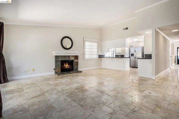 a view of an empty room with a fireplace