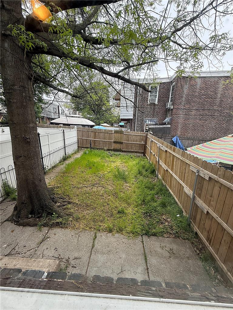 5107 Cottage Street, Unit 1 Philadelphia, PA 19124 - Photo 7 of 7 A fenced backyard offers a private green space, perfect for outdoor enjoyment.
