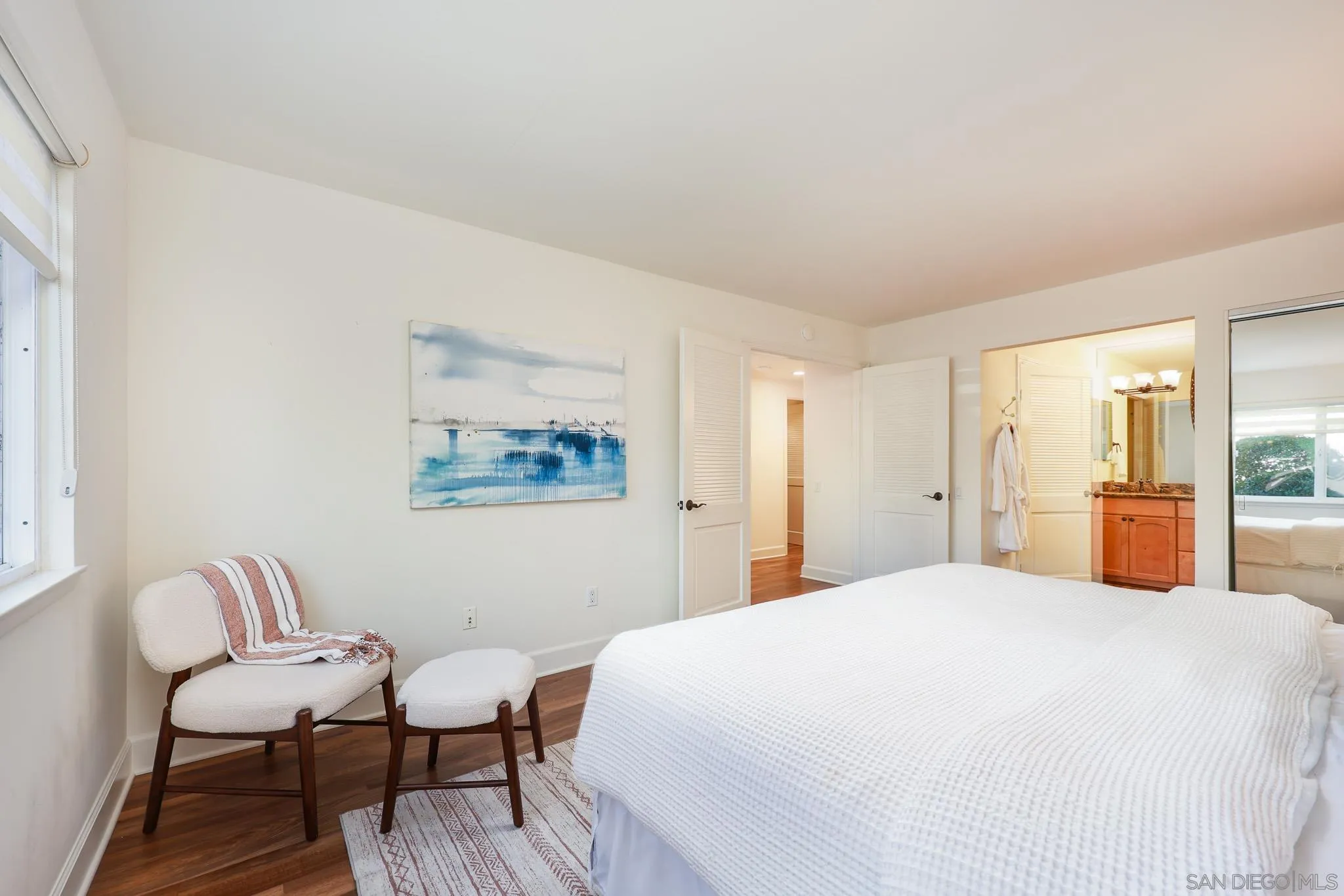234 Turf View Drive Solana Beach, CA 92075 - Photo 12 of 29 a spacious bedroom with a bed and a chair