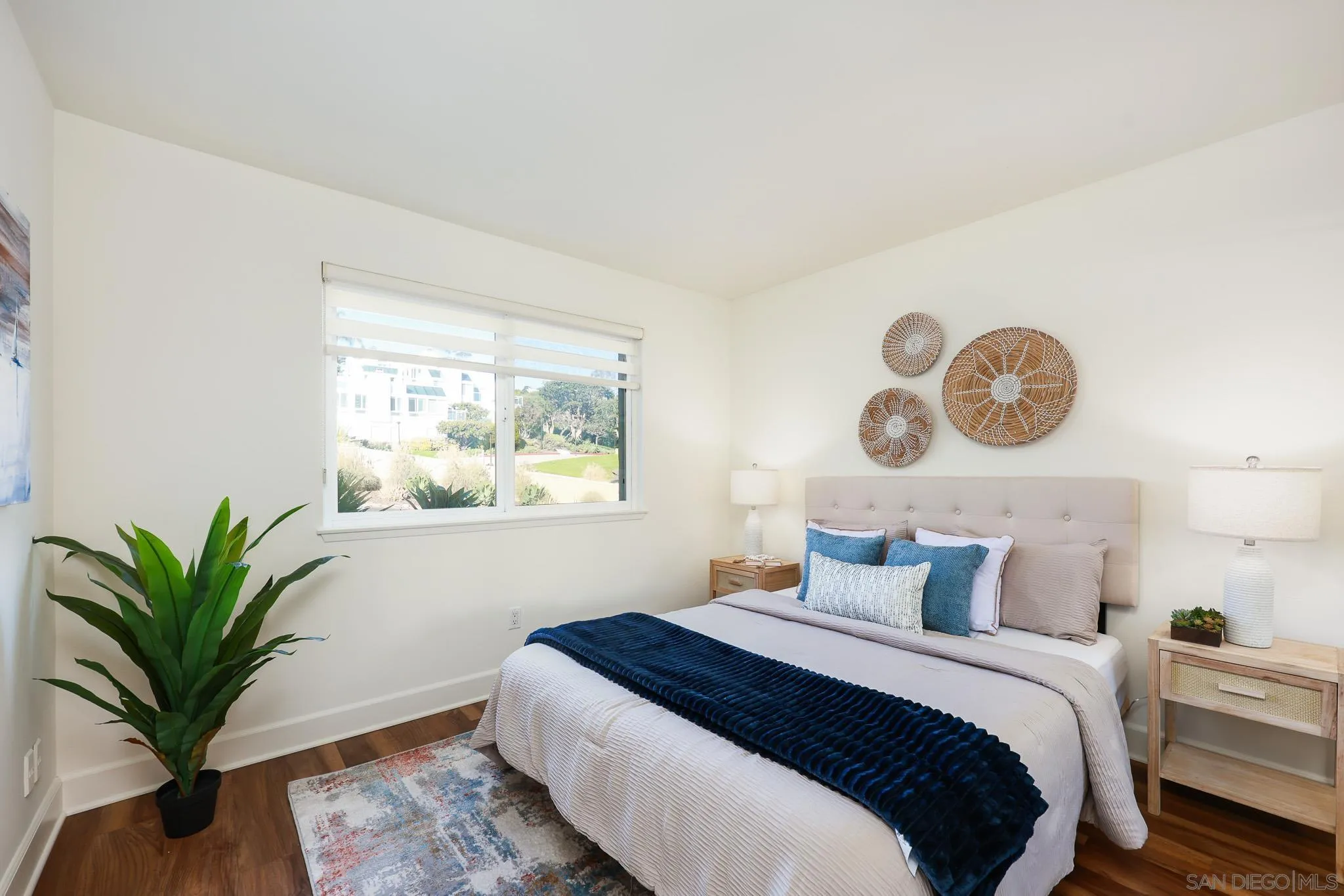 234 Turf View Drive Solana Beach, CA 92075 - Photo 16 of 29 a bedroom with a large bed and a potted plant