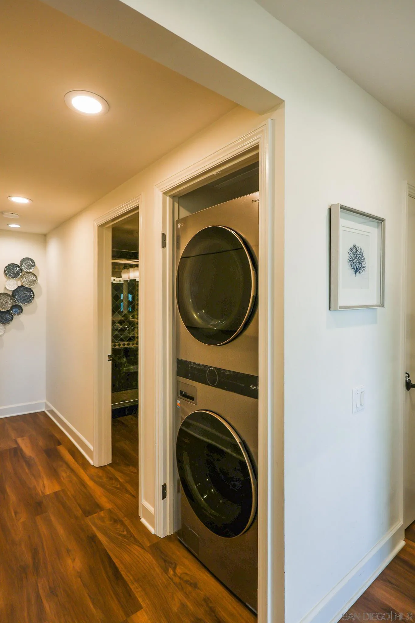 234 Turf View Drive Solana Beach, CA 92075 - Photo 17 of 29 a view of a hallway with washer and dryer
