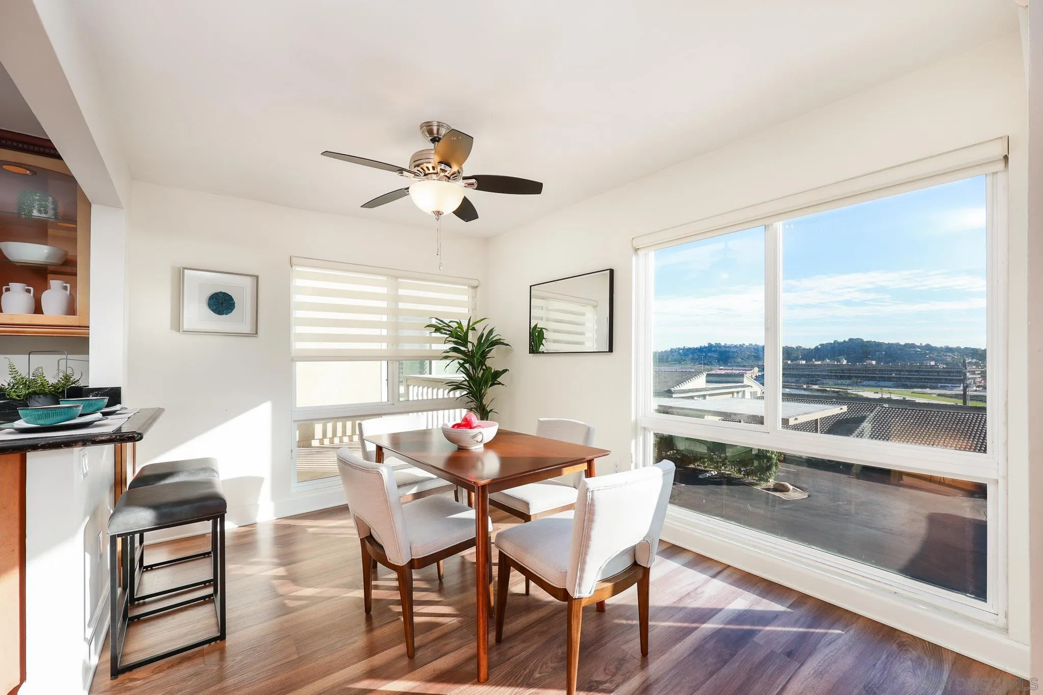 234 Turf View Drive Solana Beach, CA 92075 - Photo 7 of 29 a dining room with furniture a chandelier and wooden floor