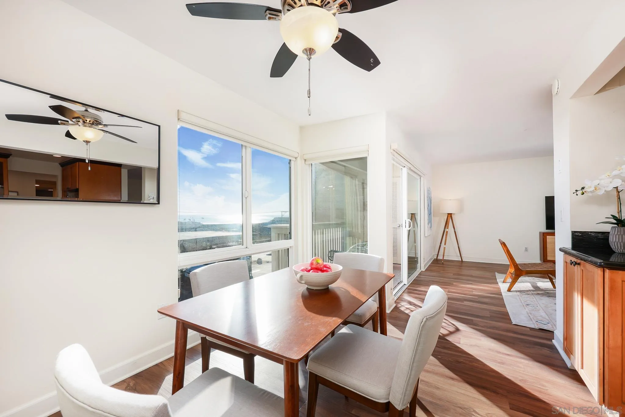 234 Turf View Drive Solana Beach, CA 92075 - Photo 9 of 29 a living room with furniture a flat screen tv and a chandelier