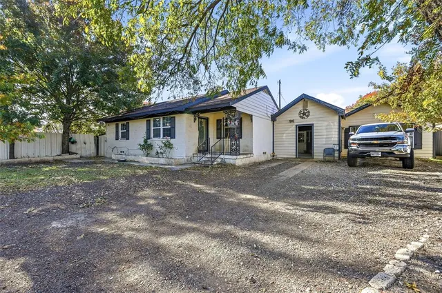 a house with a truck parked in front of a house