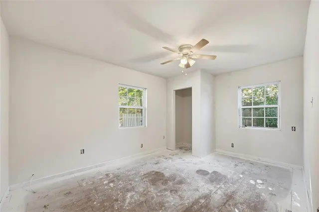 a view of an empty room with a window