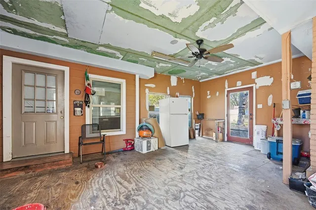 a kitchen with stainless steel appliances a refrigerator sink and cabinets
