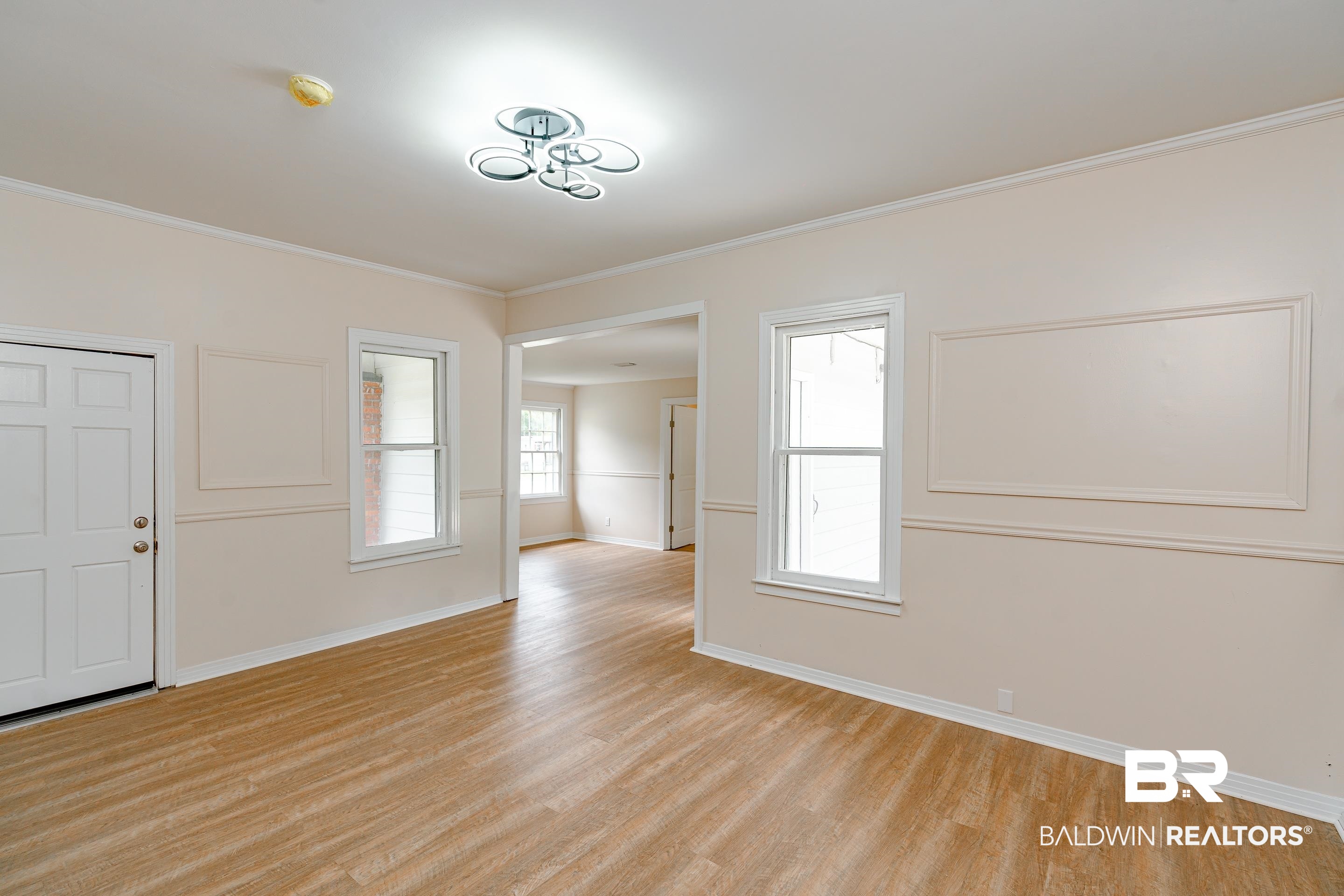 1160 Military Road Mount Vernon, AL 36560 - Photo 5 of 30 Empty room with light hardwood / wood-style flooring and ornamental molding