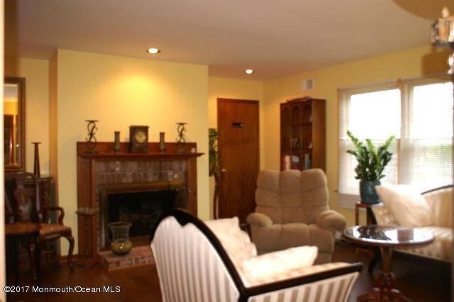 129 Frank Applegate Road Jackson, NJ 08527 - Photo 13 of 28 a living room with furniture and a fireplace