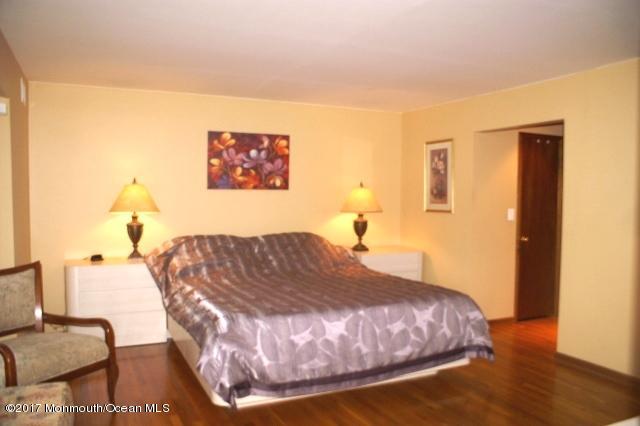 129 Frank Applegate Road Jackson, NJ 08527 - Photo 16 of 28 a bedroom with a bed and wooden floor