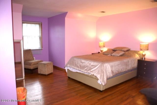 129 Frank Applegate Road Jackson, NJ 08527 - Photo 21 of 28 a bedroom with a bed and wooden floor