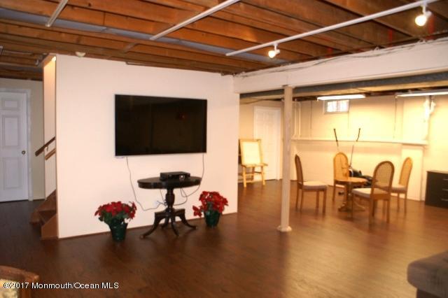 129 Frank Applegate Road Jackson, NJ 08527 - Photo 24 of 28 a living room with chairs and a flat screen tv