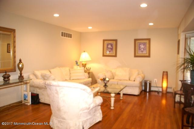 129 Frank Applegate Road Jackson, NJ 08527 - Photo 3 of 28 a living room with couches and kitchen view with wooden floor
