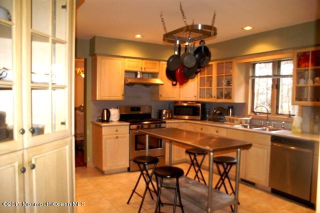 129 Frank Applegate Road Jackson, NJ 08527 - Photo 7 of 28 a kitchen with a sink a counter top space appliances and cabinets