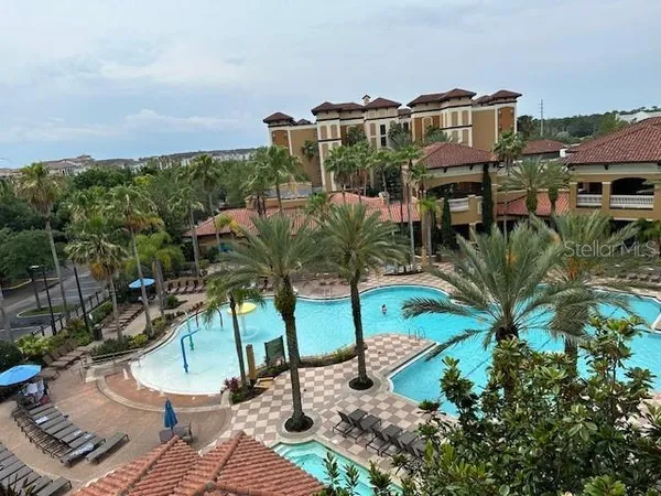 a view of a chairs and table in patio