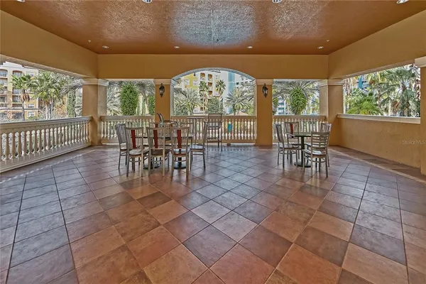 an outdoor dining space with furniture