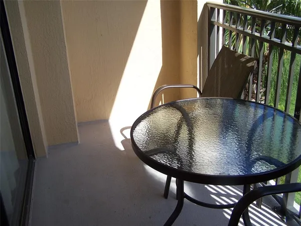 a view of a swimming pool with a porch
