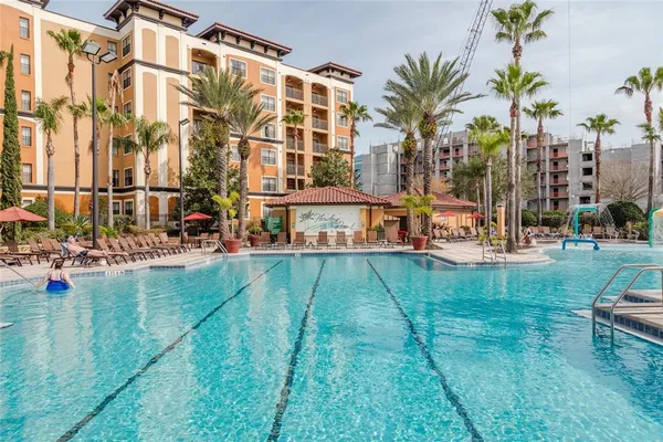 a view of a tall building with a yard