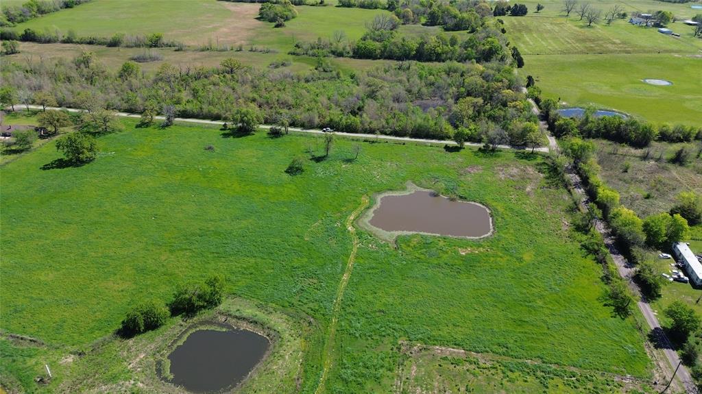 Lot 4 County Road 3410 Emory, TX 75440 - Photo 13 of 27 a backyard of a house with a yard and lake view