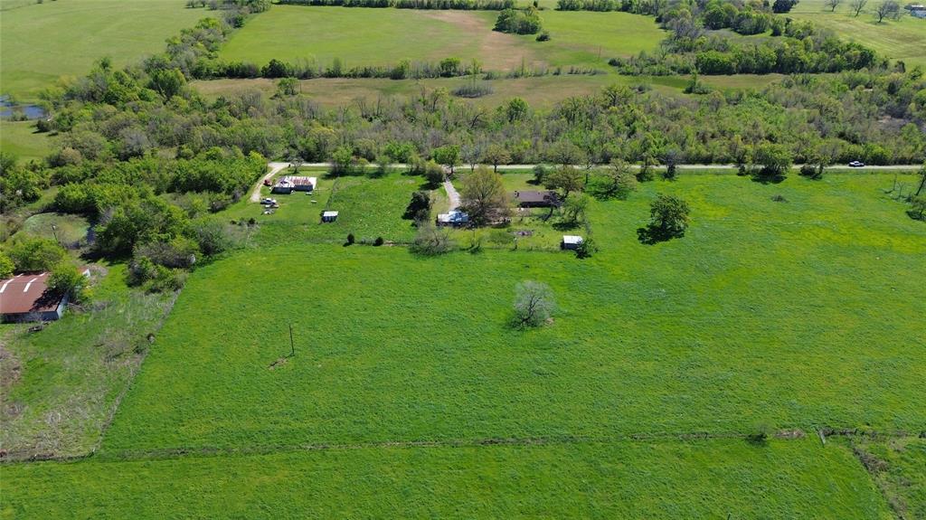 Lot 4 County Road 3410 Emory, TX 75440 - Photo 16 of 27 a view of a green field with lots of bushes