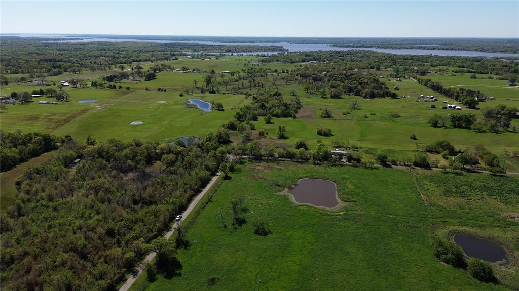Lot 4 County Road 3410 Emory, TX 75440 - Photo 26 of 27 a view of a city with lush green forest