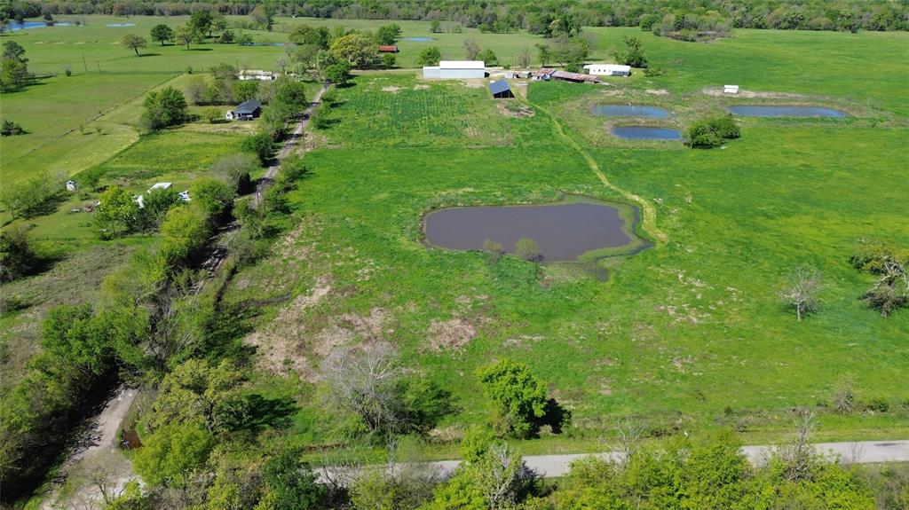 Lot 4 County Road 3410 Emory, TX 75440 - Photo 5 of 27 a view of a garden with a lake