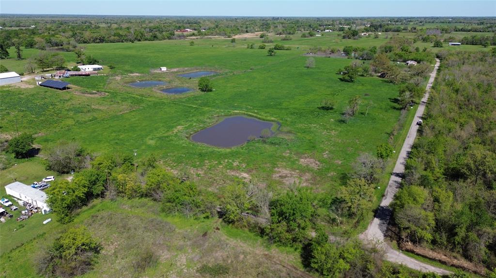Lot 4 County Road 3410 Emory, TX 75440 - Photo 7 of 27 a view of a lush green outdoor space with a lake view